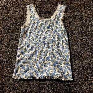 This is tween girl floral tank top with blue green & white